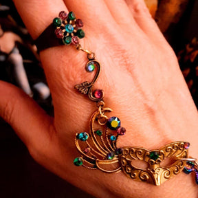 slave bracelet hand chain with adjustable flower ring and masks. colcorful flowers and vines a serpent snake and swarovski crystals