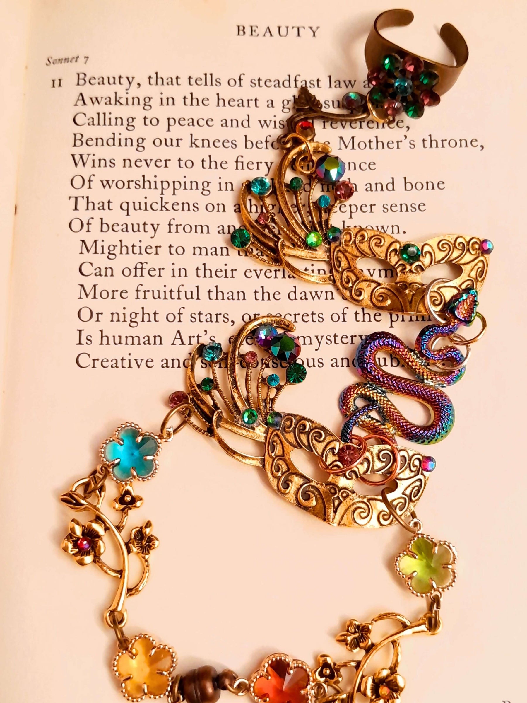 slave bracelet hand chain with adjustable flower ring and masks. colcorful flowers and vines a serpent snake and swarovski crystals