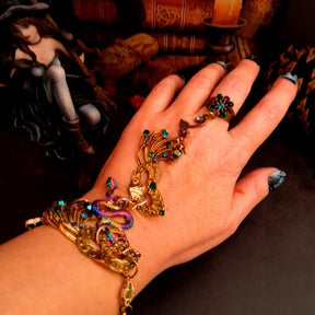 slave bracelet hand chain with adjustable flower ring and masks. colcorful flowers and vines a serpent snake and swarovski crystals