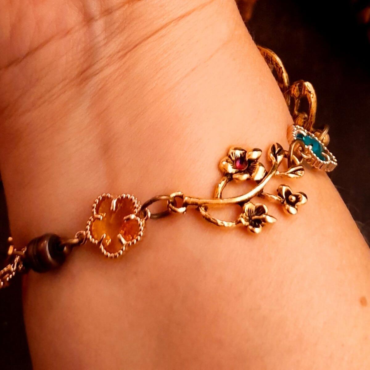 slave bracelet hand chain with adjustable flower ring and masks. colcorful flowers and vines a serpent snake and swarovski crystals