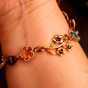 slave bracelet hand chain with adjustable flower ring and masks. colcorful flowers and vines a serpent snake and swarovski crystals