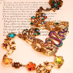 slave bracelet hand chain with adjustable flower ring and masks. colcorful flowers and vines a serpent snake and swarovski crystals