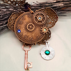 Back view of handmade magical fantasy steampunk butterfly necklace with brass clock face and gear charms, Victorian style vintage style boho jewelry