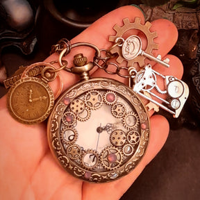 Steampunk fantasy necklace with skeleton key and clock face charms in Victorian style brass tones