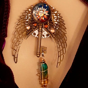 boho hippie sun and moon cabochon necklace glass icicle in pink yellow and green. angel wings swarovski crystals