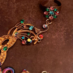 slave bracelet hand chain with adjustable flower ring and masks. colcorful flowers and vines a serpent snake and swarovski crystals