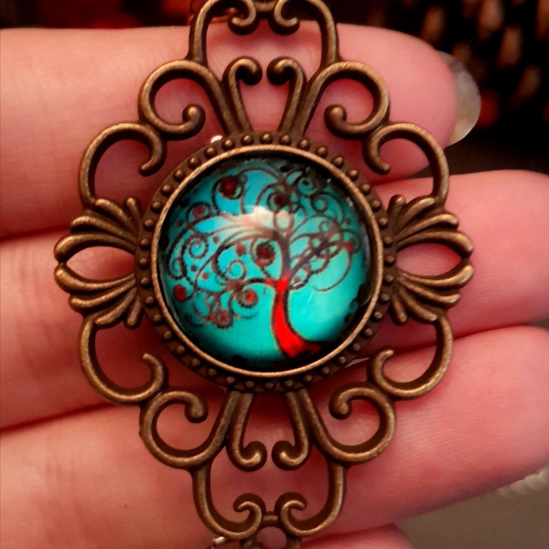 Victorian style bird necklace with tree of life cabochon, bird cage and bird, turquoise swarovski crystals silver filigree moon gold star and copper leaf. 