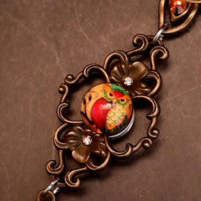 necklace with 3 owl cabochons with yellow backgrounds and Yellow Swarovski crystals