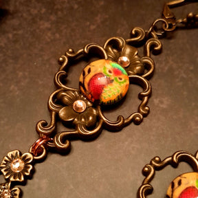4 owl cabochons nesstled into victorian style brass settings. swarovski crystals