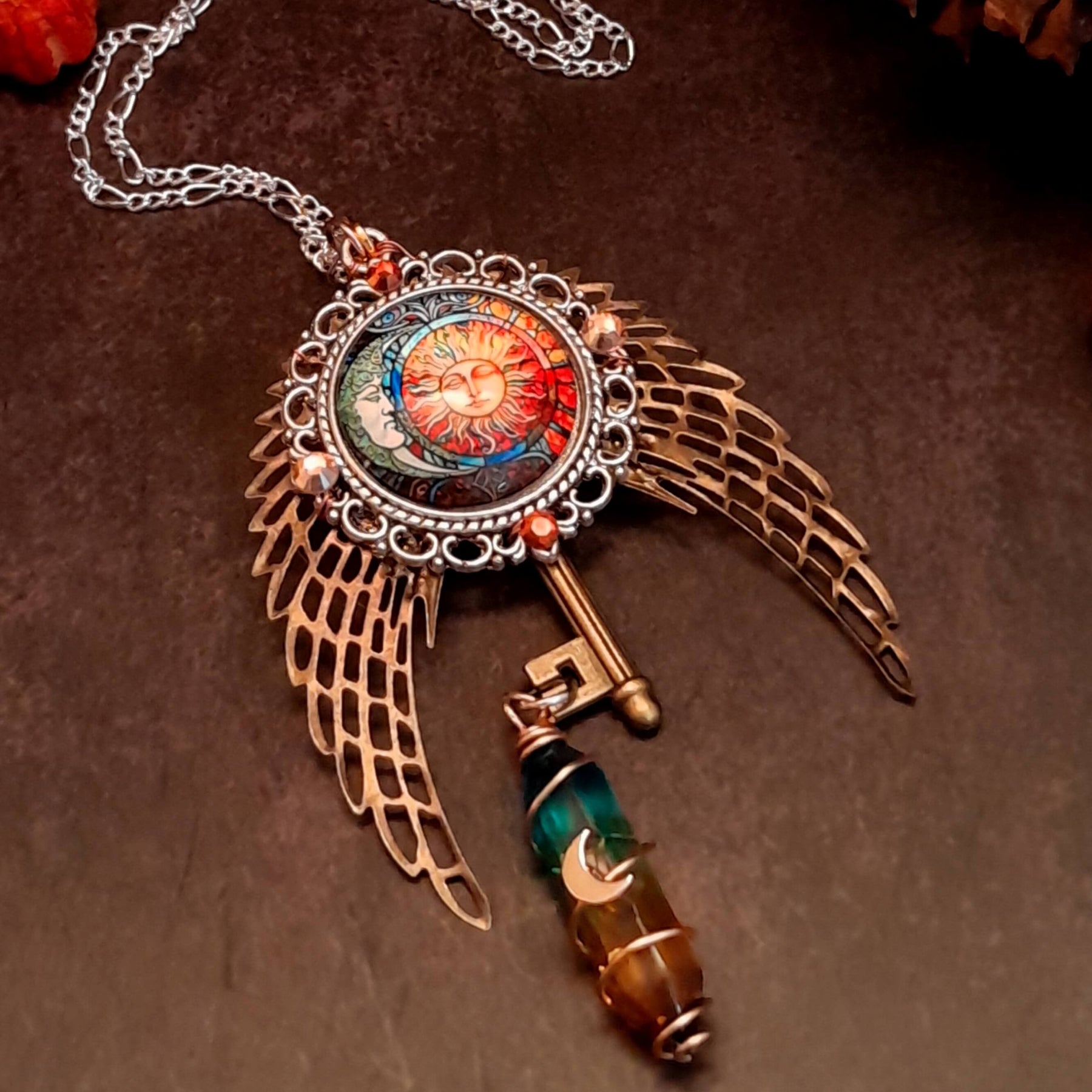 boho hippie sun and moon cabochon necklace glass icicle in pink yellow and green. angel wings swarovski crystals