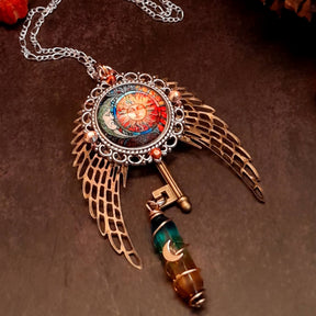 boho hippie sun and moon cabochon necklace glass icicle in pink yellow and green. angel wings swarovski crystals