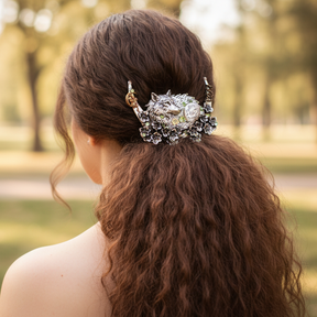 Woman with thick brown hair in ponytail wearing fantasy hair clip wolf green crystals swarovski