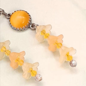 Handmade Victorian style vintage style yellow Swarovski crystal earrings with cat's eye crown setting