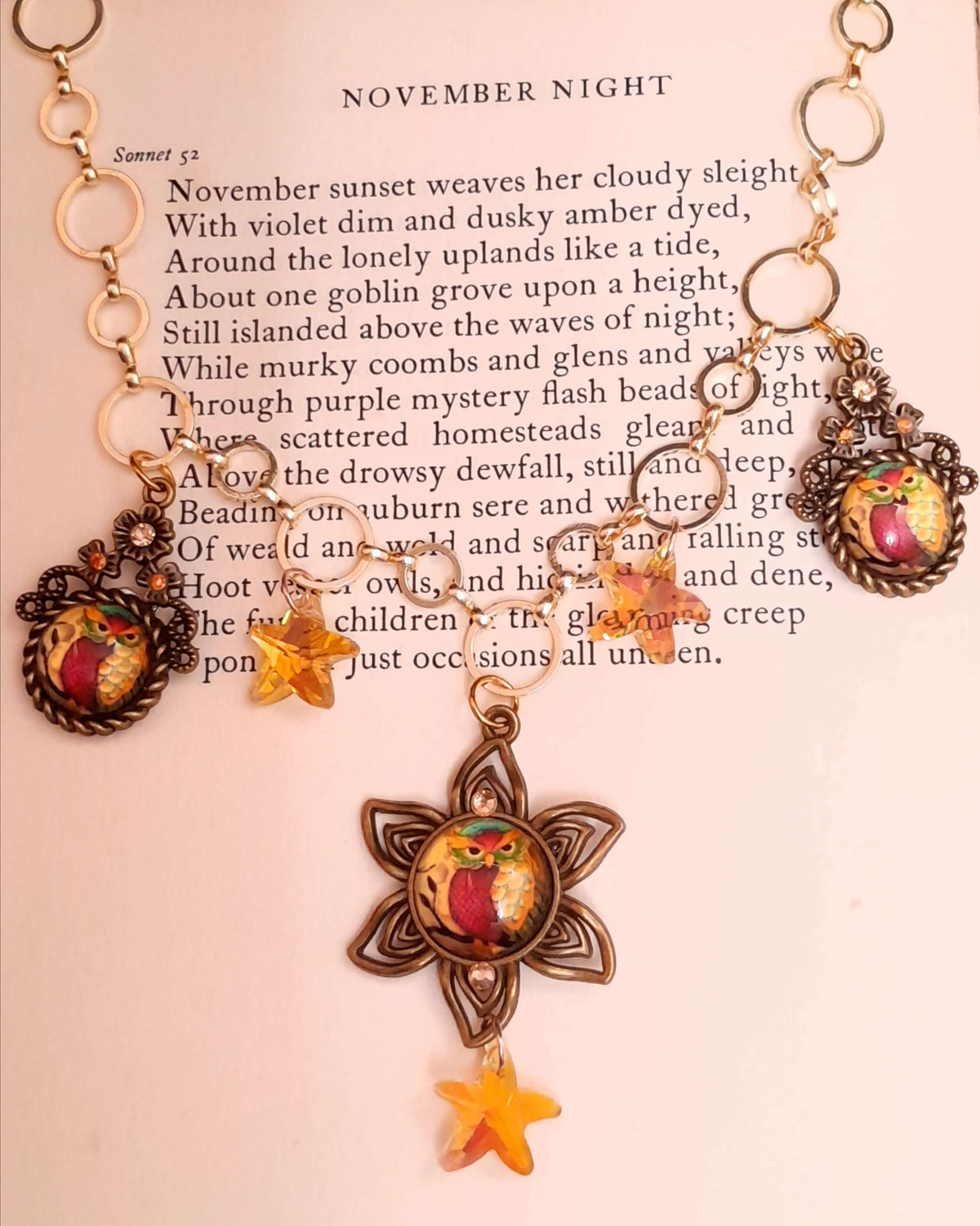 owl necklace with yellow star crystals and yellow brown tones floral settings for owl cabochons