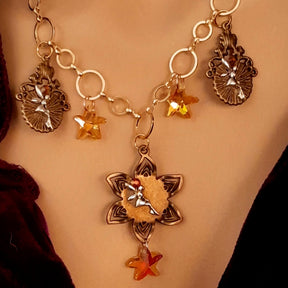 owl necklace with yellow star crystals and yellow brown tones floral settings for owl cabochons