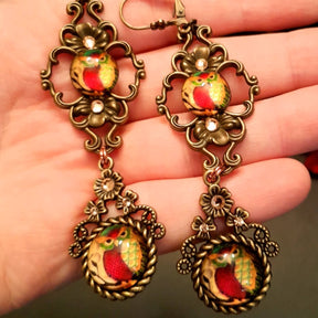 4 owl cabochons nesstled into victorian style brass settings. swarovski crystals