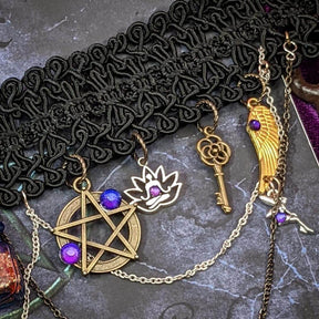 black choker charm closeup key pentagram chains