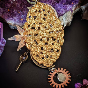 back of vault of time blue sapphire necklace gold decorations
