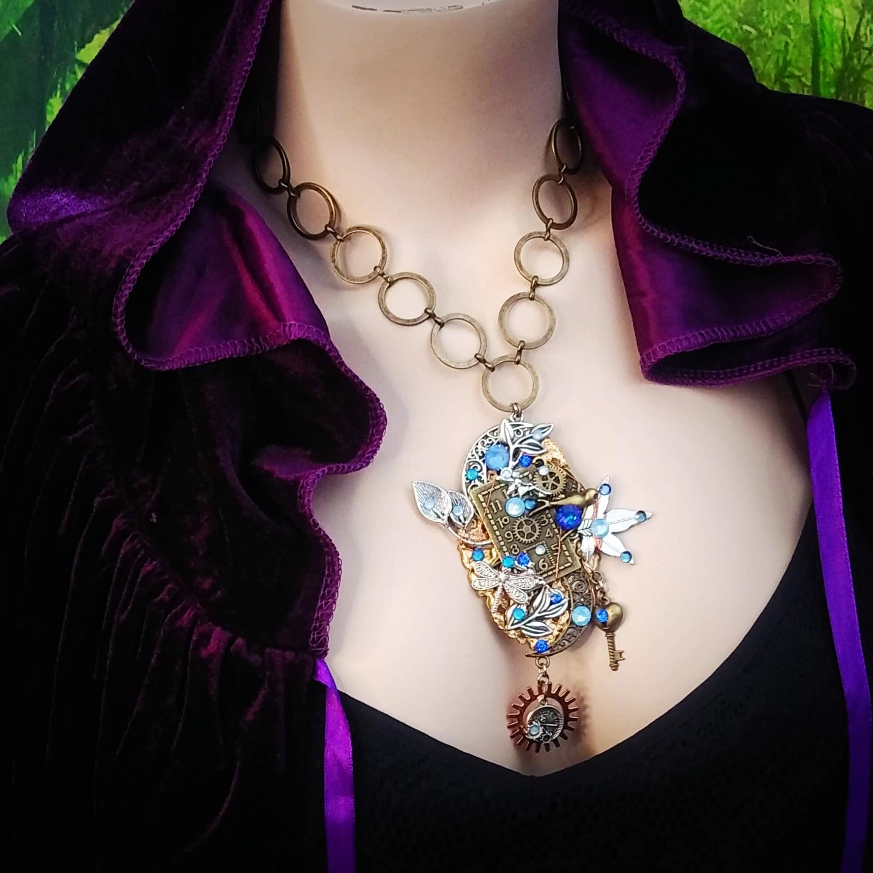 sapphire blue clock necklace on mannequin
